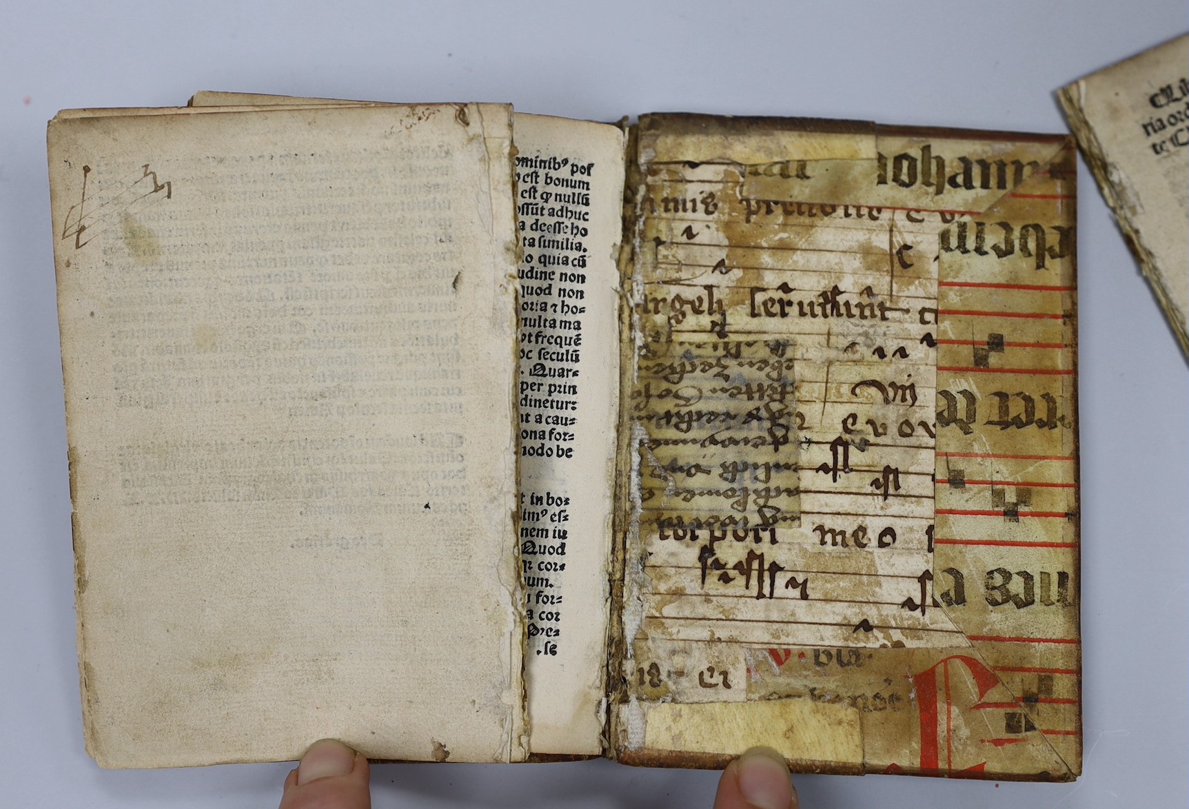 Savonarola, Girolamo, (De Simplicitate Christiane Vite). 48 (ex:60) ff., 3 decorated initial letters; bound in fragments of an old service book (with music notation), sm. 8vo. (Paris: in chalcographia Ascensiana, 1510)